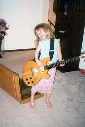 Savanna playing the guitar